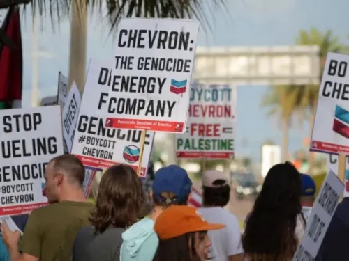 Image of protestors calling to boycott Chevron for its role in Israel's genocide against Palestinians 