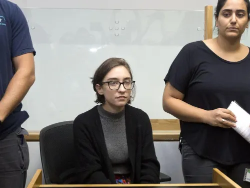 Lara Alqasem sits in a courtroom prior to a hearing at the district court in Tel Aviv, Thursday, Oct. 11, 2018. (Photo: Sebastian Scheiner / AP)