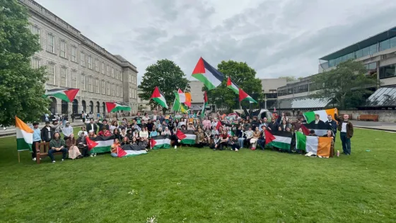 Trinity College Dublin students celebrate the school's decision to divest from Israeli companies linked to human rights crimes against Palestinians, on May 8, 2024 in Dublin.