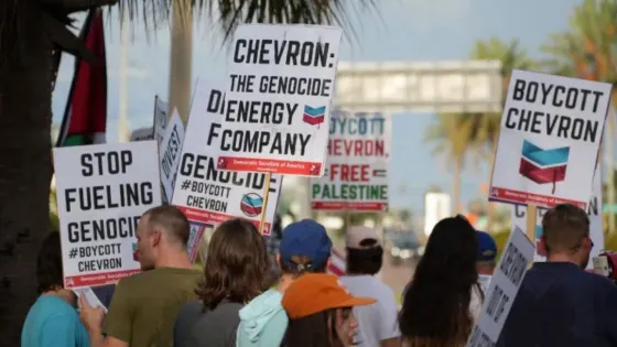 Image of protestors calling to boycott Chevron for its role in Israel's genocide against Palestinians 