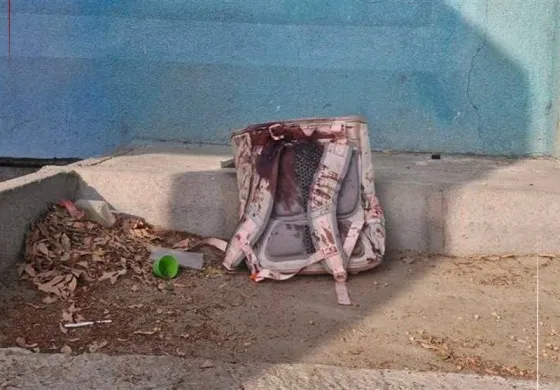 Backpack soaked in blood following attack on Tehran school