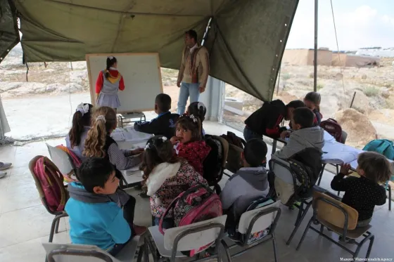Palestinian students have their lessons inside a tent after Israeli forces demolished a primary school in Hebron, West Bank